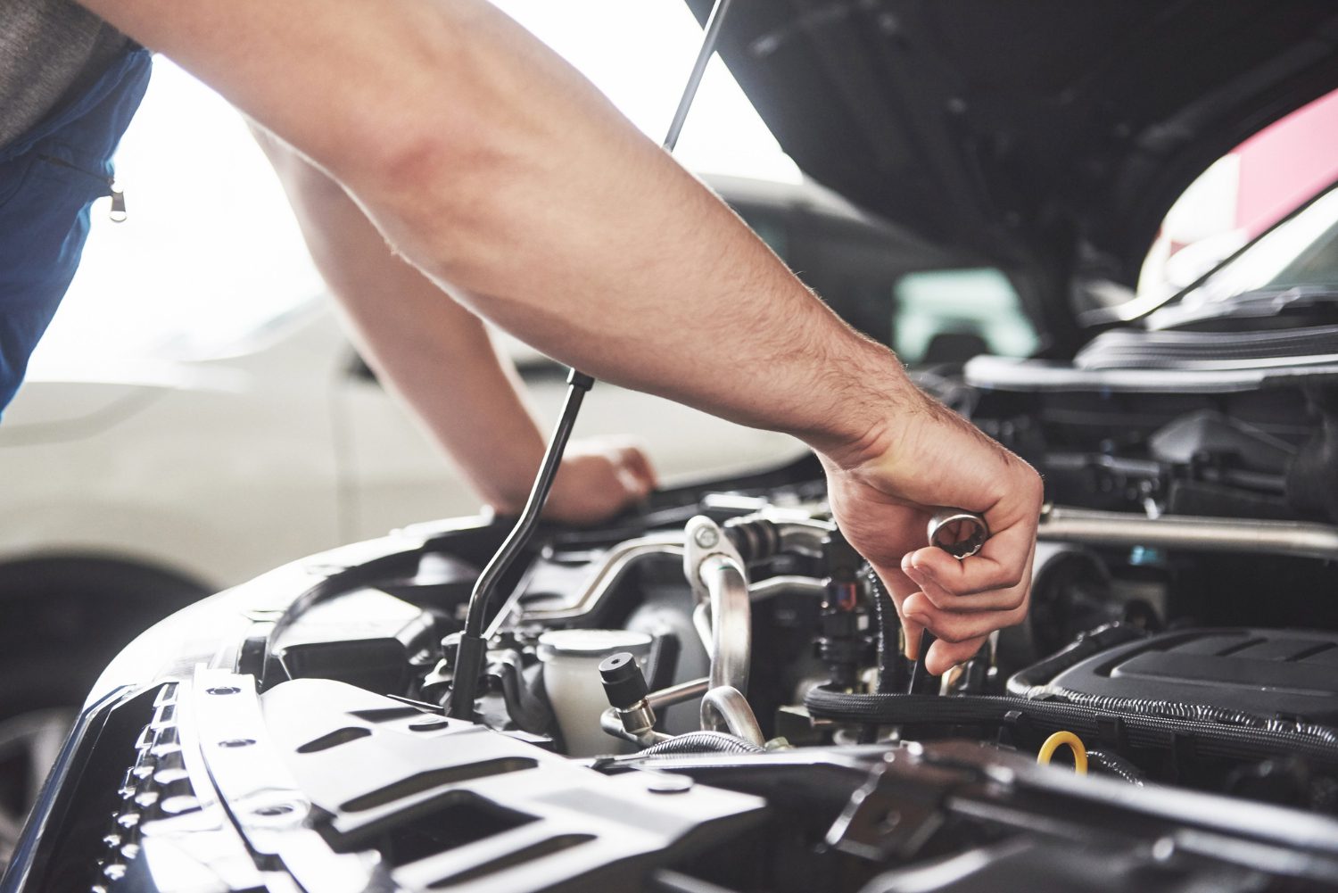 close-up-hands-unrecognizable-mechanic-doing-car-service-maintenance Auto & Tire