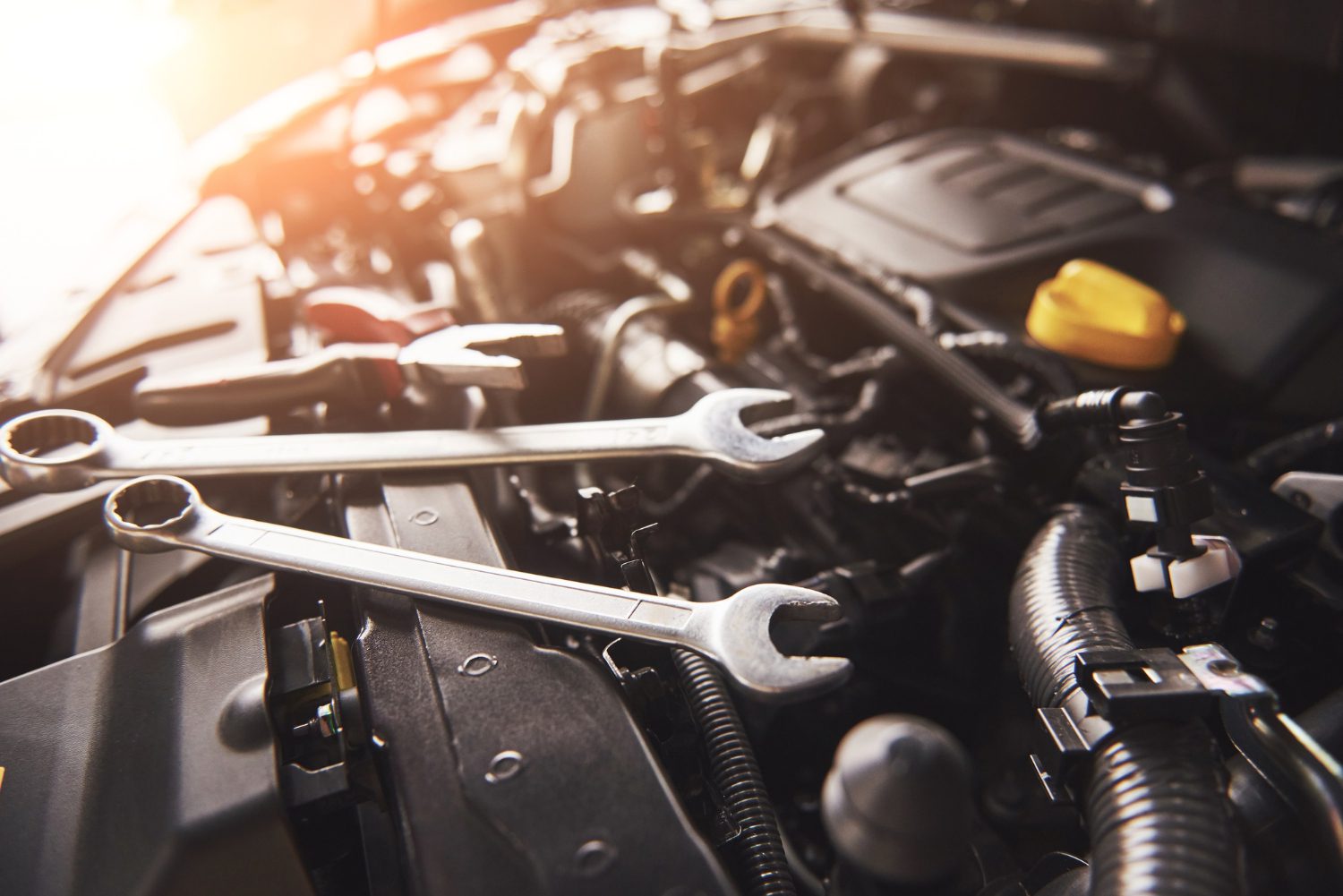 mechanic-hand-checking-fixing-broken-car-car-service-garage Auto & Tire