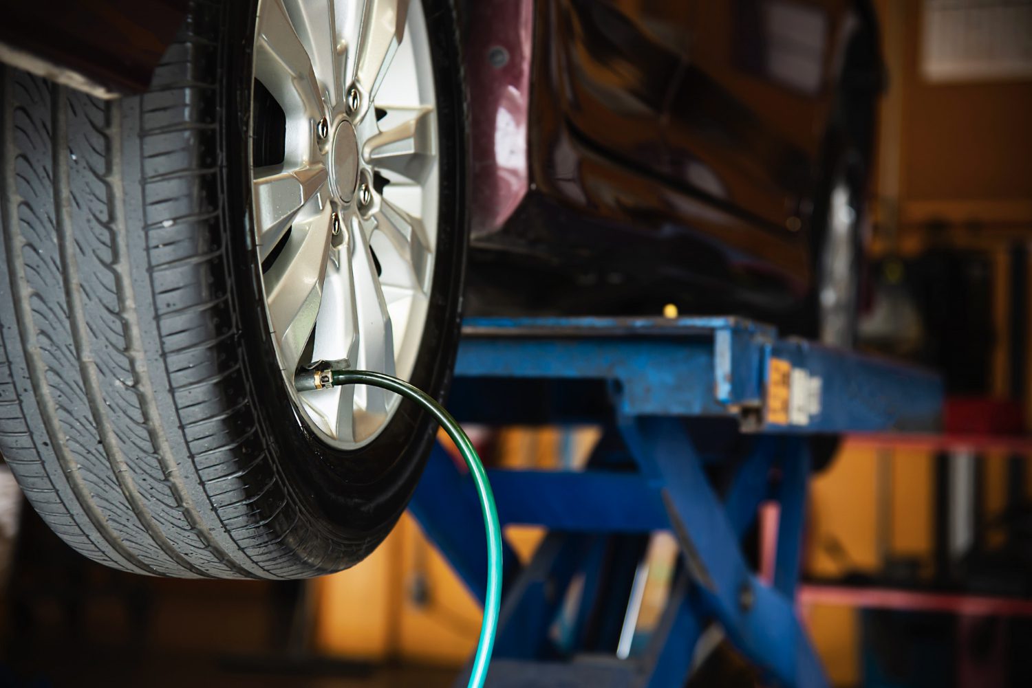 technician-is-inflate-car-tire-car-maintenance-service-transportation-safety technician-is-inflate-car-tire-car-maintenance-service-transportation-safety
